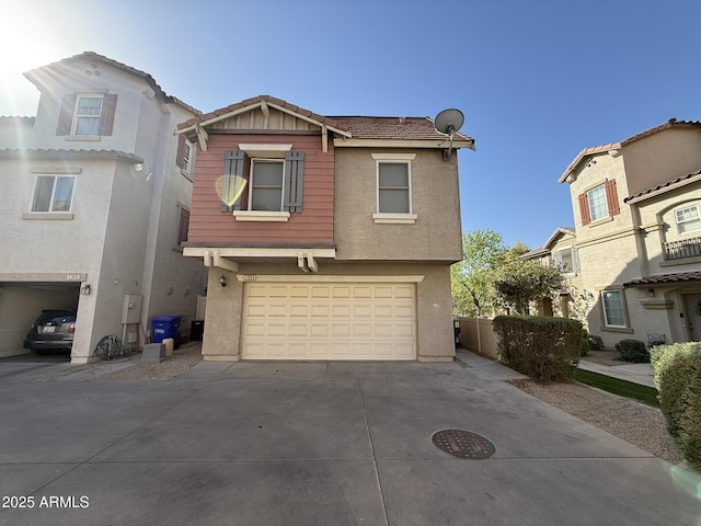 view of front of house with an attached garage, concrete driveway, and stucco siding