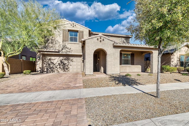 mediterranean / spanish-style house featuring a garage