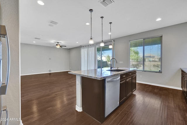 kitchen featuring sink, pendant lighting, dishwasher, dark hardwood / wood-style floors, and an island with sink