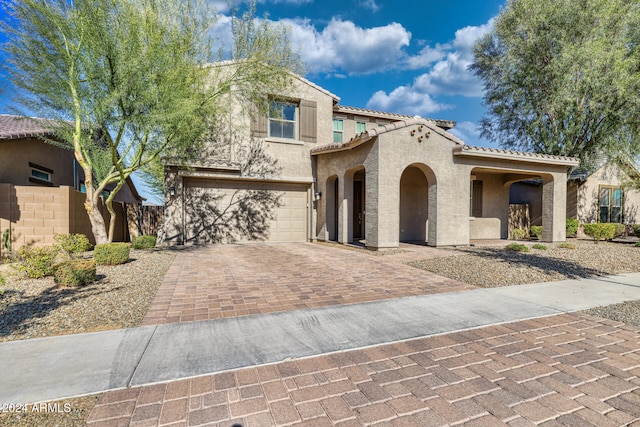 mediterranean / spanish-style house featuring a garage