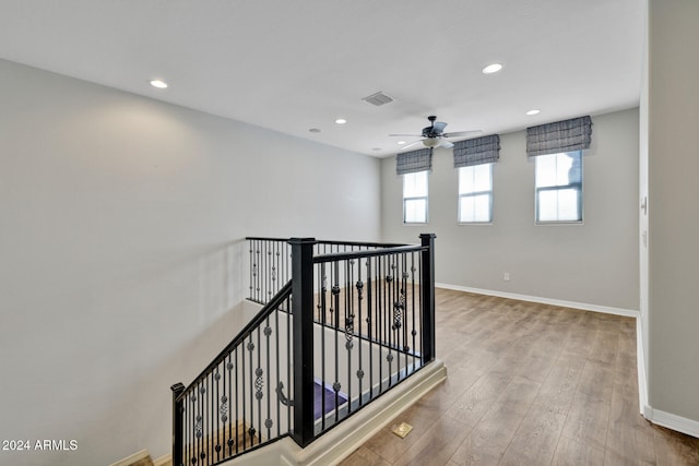 hall with hardwood / wood-style floors