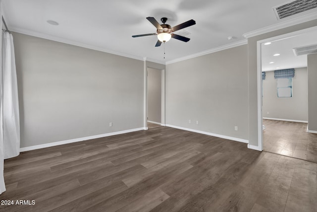 spare room featuring crown molding, ceiling fan, and dark hardwood / wood-style floors