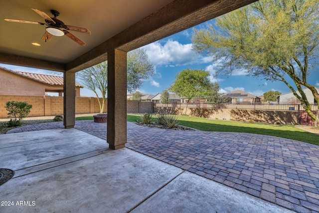 view of patio featuring ceiling fan