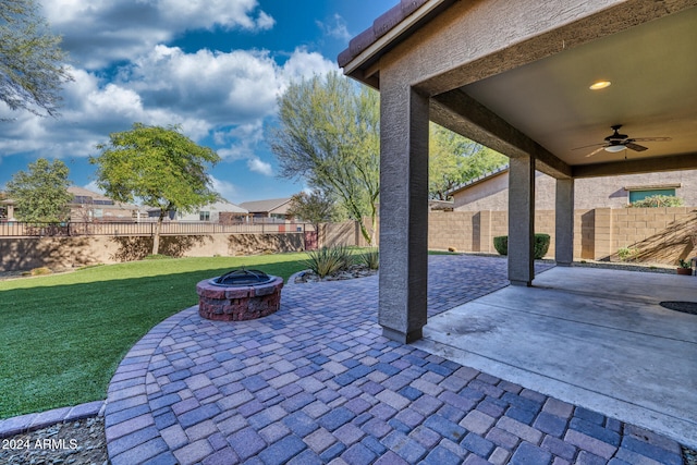 view of patio featuring a fire pit and ceiling fan