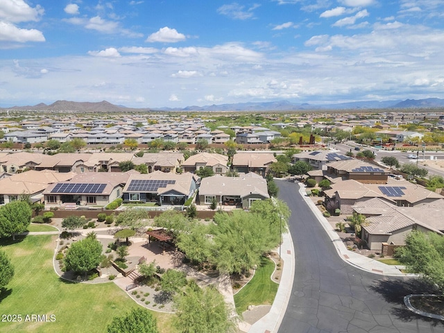 aerial view of residential area with a mountainous background