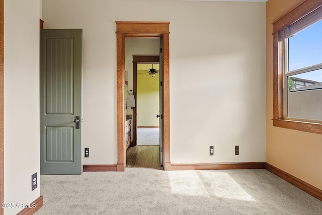 unfurnished bedroom featuring carpet and baseboards