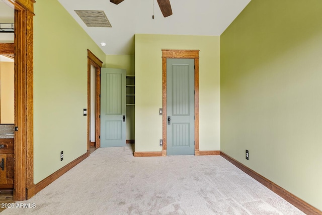 unfurnished bedroom featuring baseboards, carpet, and ceiling fan