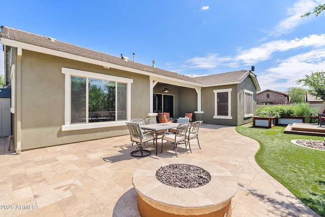 view of patio / terrace featuring outdoor dining space and a ceiling fan