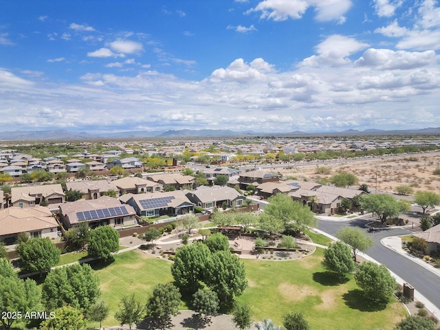 aerial view of residential area featuring a mountainous background