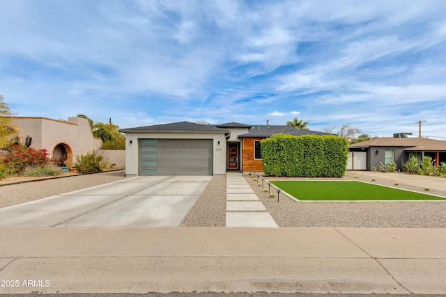 4331 N 19th Pl, Phoenix, AZ 85016 - view of front of property featuring an attached garage, stucco siding, and concrete driveway