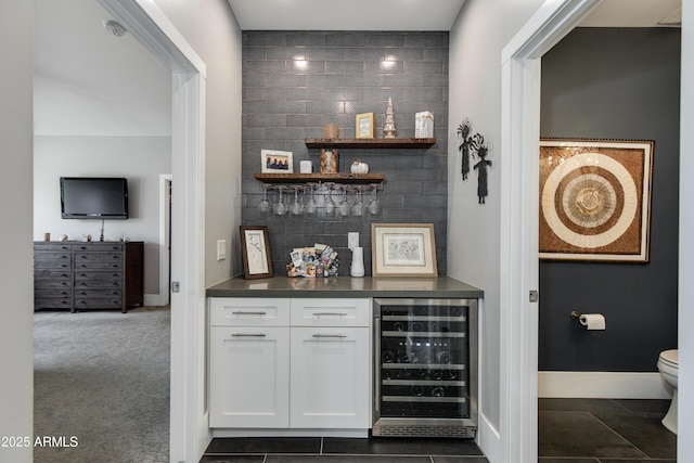 4331 N 19th Pl, Phoenix, AZ 85016 - bar featuring a bar, baseboards, and beverage cooler