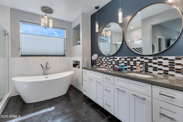 4331 N 19th Pl, Phoenix, AZ 85016 - full bathroom featuring a sink, a freestanding bath, double vanity, and a notable chandelier