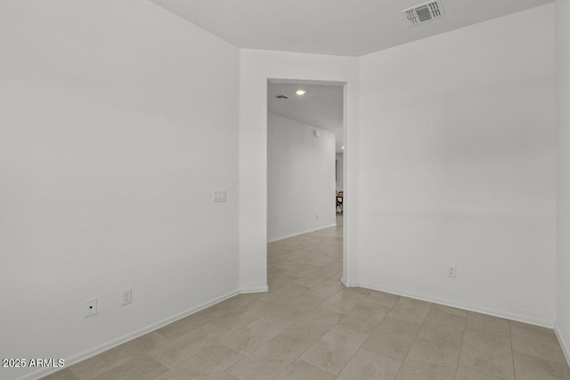 unfurnished room featuring visible vents and baseboards