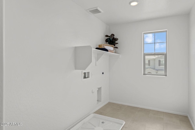 clothes washing area with hookup for a washing machine, visible vents, gas dryer hookup, electric dryer hookup, and laundry area