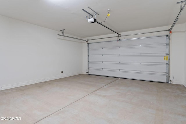 garage featuring baseboards and a garage door opener