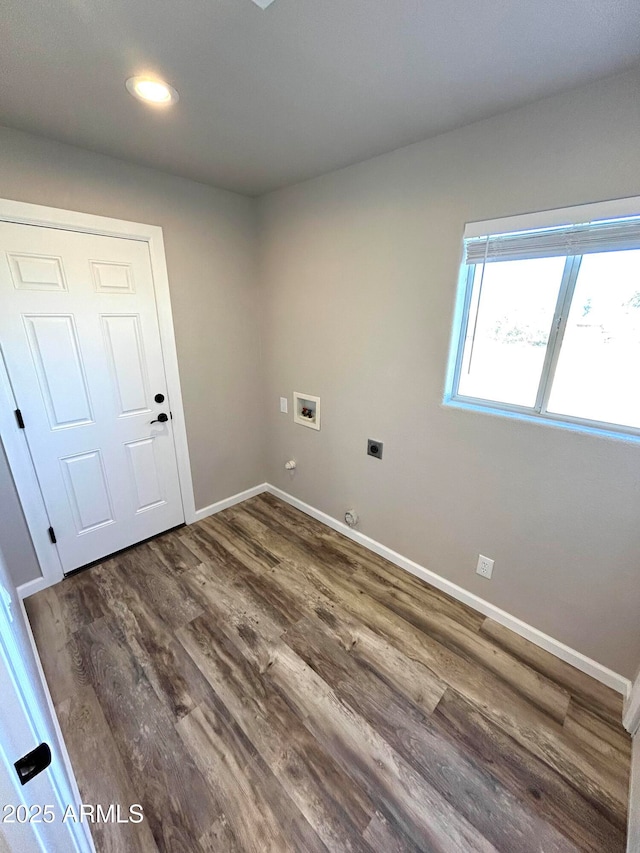 laundry room featuring gas dryer hookup, dark wood-type flooring, hookup for an electric dryer, and hookup for a washing machine