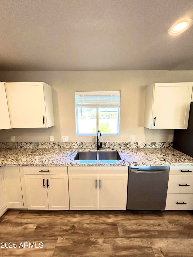 kitchen featuring sink, white cabinetry, and dishwasher