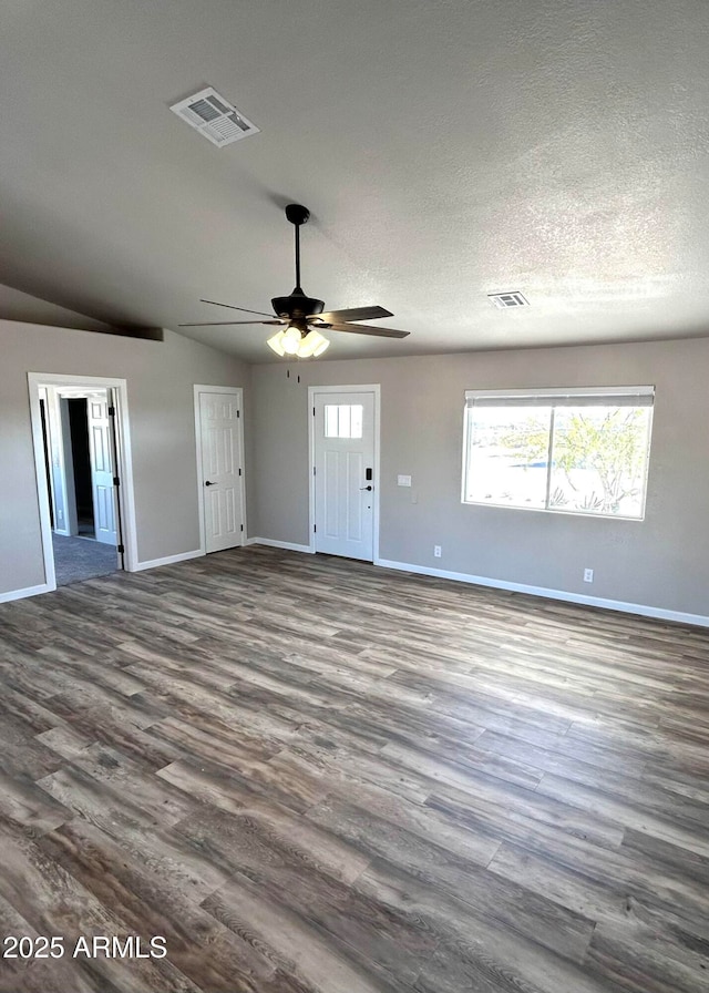 interior space with vaulted ceiling, ceiling fan, and hardwood / wood-style floors