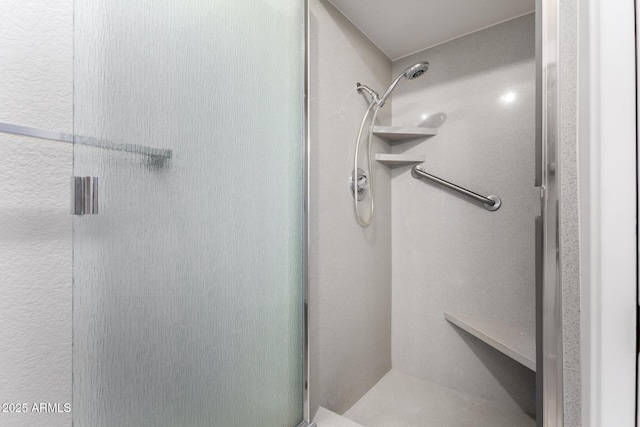 full bath featuring a shower stall