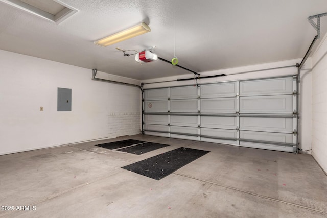 garage featuring a garage door opener and electric panel