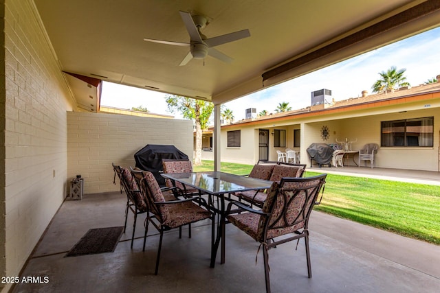 view of patio / terrace featuring a ceiling fan, central AC unit, outdoor dining area, and grilling area