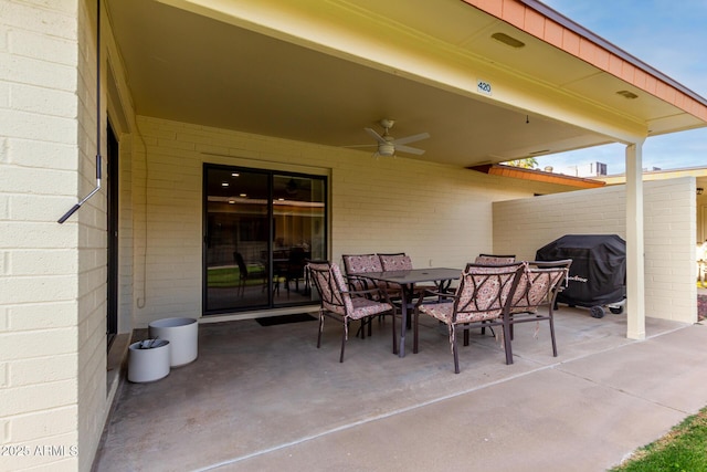 view of patio / terrace featuring outdoor dining area, ceiling fan, and area for grilling