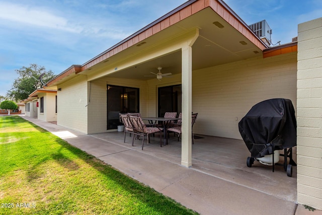 view of patio featuring outdoor dining area, a ceiling fan, and grilling area