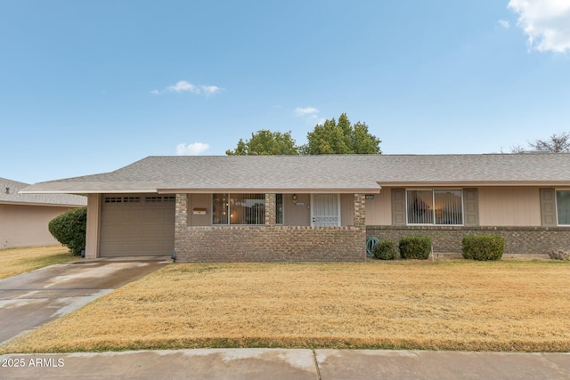 ranch-style house with a garage and a front lawn