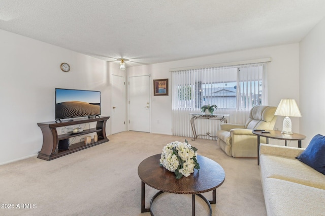 living room with light colored carpet and a textured ceiling