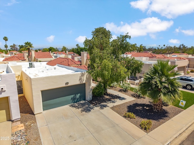 2170 E Alameda Dr, Tempe, AZ 85282 - view of front of home featuring stucco siding, driveway, and a residential view