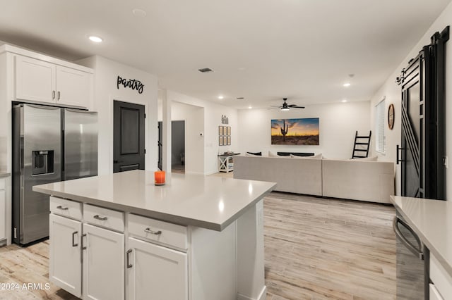 16848 W Alice Ave, Waddell, AZ 85355 - kitchen featuring stainless steel fridge with ice dispenser, light wood finished floors, white cabinets, a ceiling fan, and recessed lighting