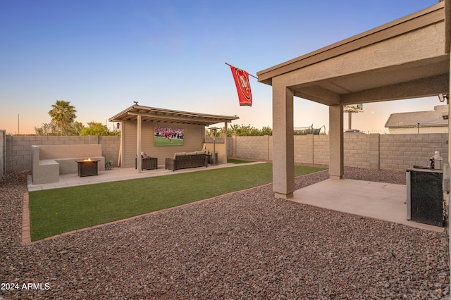 16848 W Alice Ave, Waddell, AZ 85355 - view of yard featuring a patio area and an outdoor living space with a fire pit