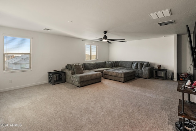 16848 W Alice Ave, Waddell, AZ 85355 - carpeted living area featuring a ceiling fan and baseboards