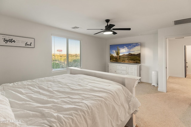 16848 W Alice Ave, Waddell, AZ 85355 - bedroom featuring light colored carpet, baseboards, and a ceiling fan