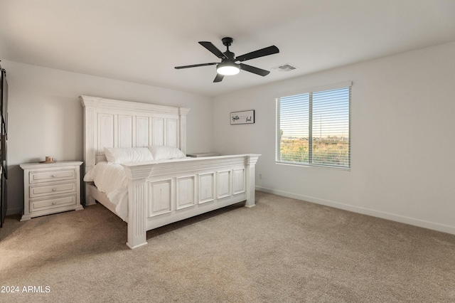 16848 W Alice Ave, Waddell, AZ 85355 - bedroom with light carpet, baseboards, and ceiling fan