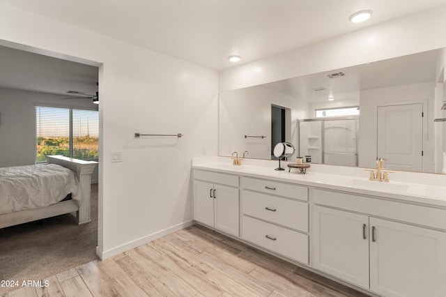 16848 W Alice Ave, Waddell, AZ 85355 - full bath with wood finished floors, double vanity, baseboards, and recessed lighting