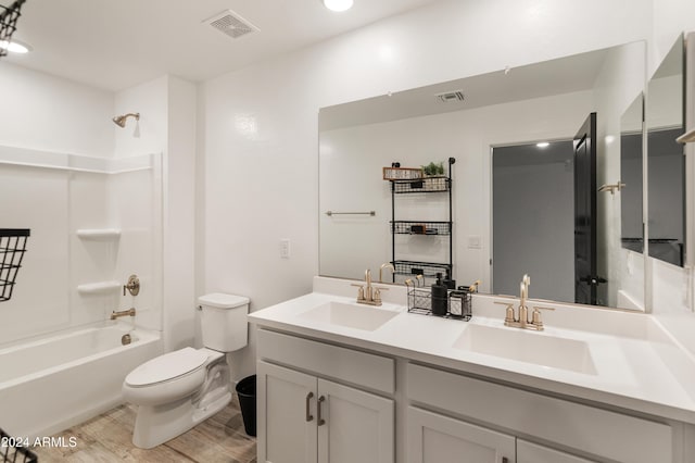 16848 W Alice Ave, Waddell, AZ 85355 - bathroom featuring toilet, wood finished floors, bathtub / shower combination, and double vanity