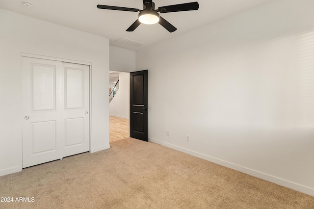 16848 W Alice Ave, Waddell, AZ 85355 - unfurnished bedroom featuring carpet, baseboards, ceiling fan, and a closet