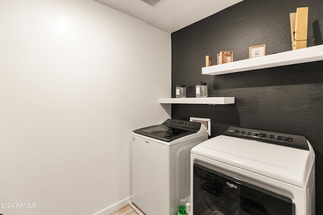 16848 W Alice Ave, Waddell, AZ 85355 - laundry room featuring washing machine and clothes dryer and baseboards