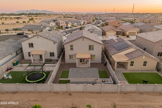 16848 W Alice Ave, Waddell, AZ 85355 - aerial view at dusk of a residential view and a mountain view