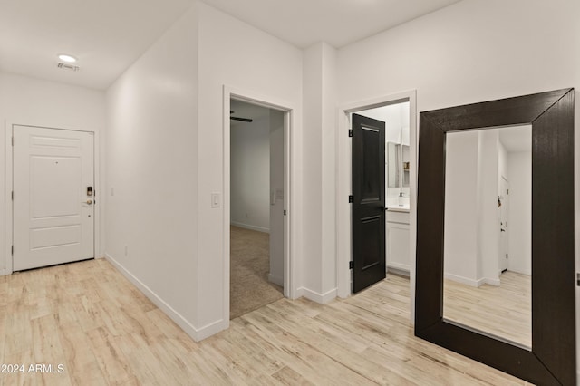 16848 W Alice Ave, Waddell, AZ 85355 - corridor featuring light wood-style flooring and baseboards