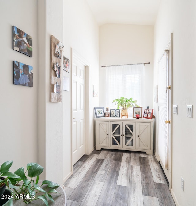 corridor with wood-type flooring