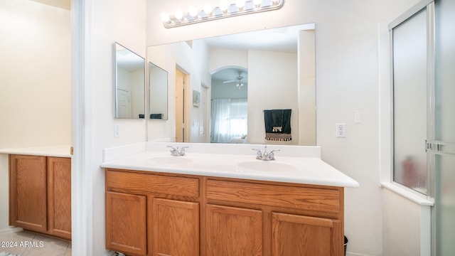 bathroom featuring tile patterned flooring, vanity, and ceiling fan