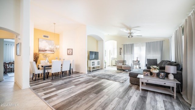 living room featuring light wood-type flooring and ceiling fan