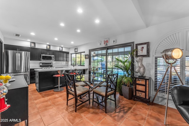 dining space with light tile patterned floors