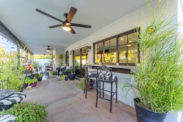 view of patio with exterior bar