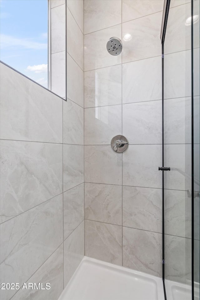 bathroom featuring a stall shower