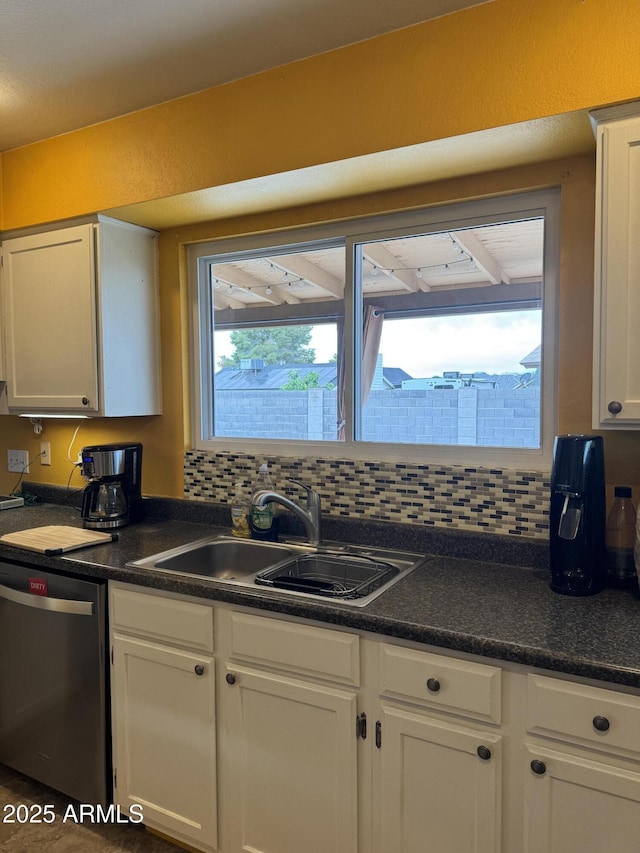 12512 N 85th Ave, Peoria, AZ 85381 - kitchen featuring dishwasher, a sink, white cabinetry, and dark countertops