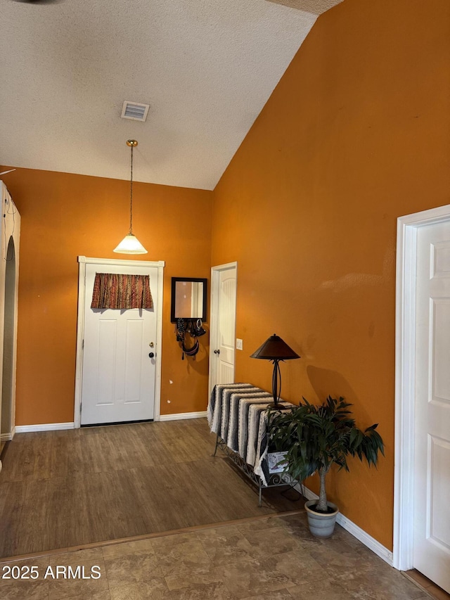 12512 N 85th Ave, Peoria, AZ 85381 - entryway with high vaulted ceiling, baseboards, and a textured ceiling