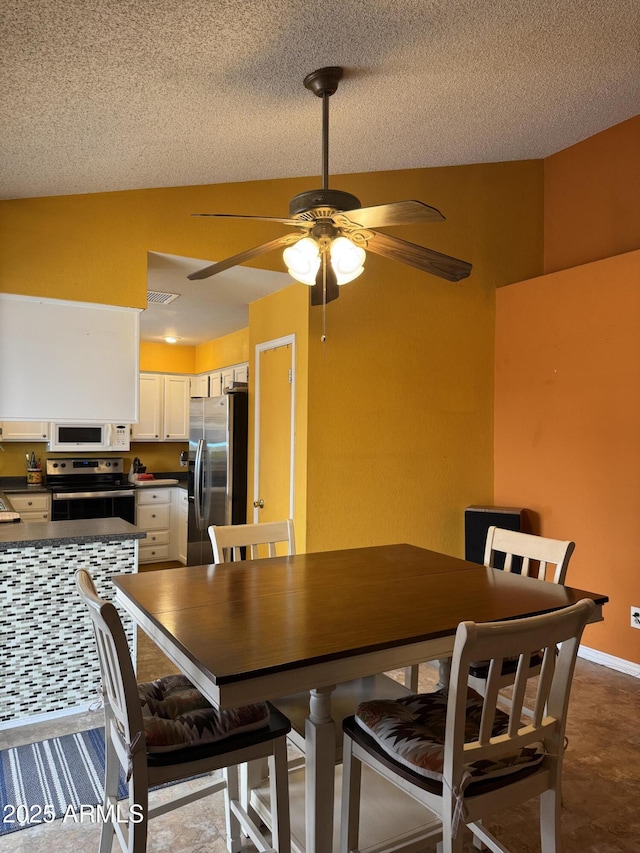 12512 N 85th Ave, Peoria, AZ 85381 - dining space with ceiling fan and a textured ceiling